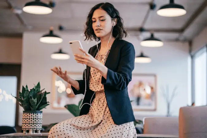Female digital marketer presenting social media strategy on tablet in a modern office