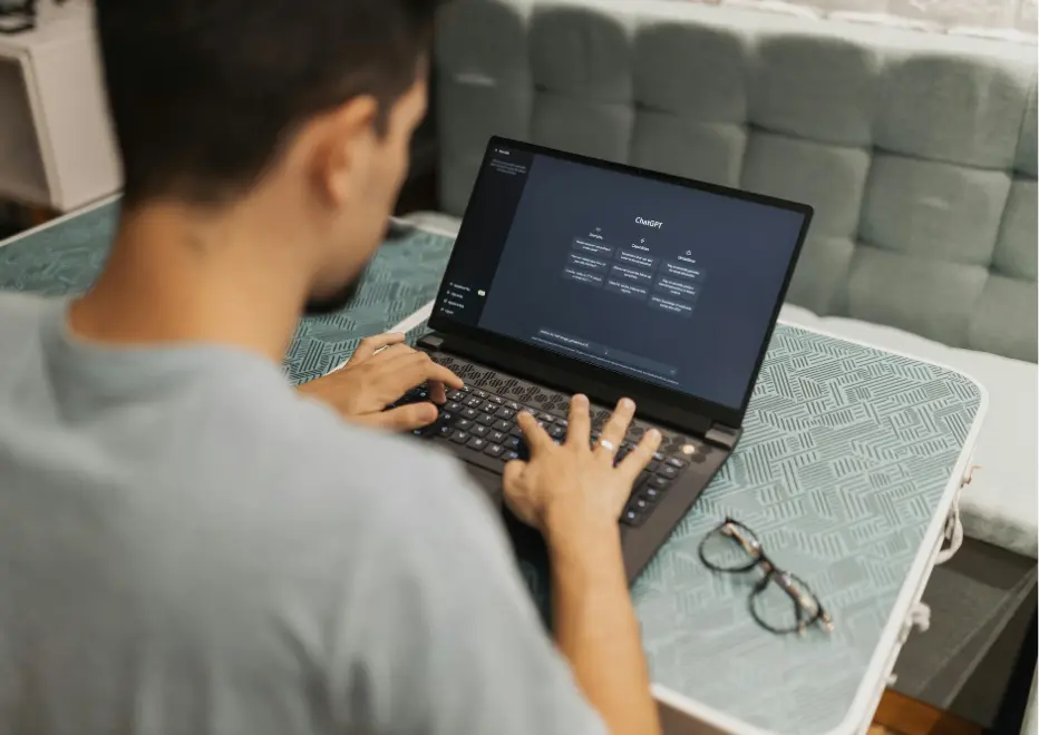 Employee using AI-powered tools on a laptop.