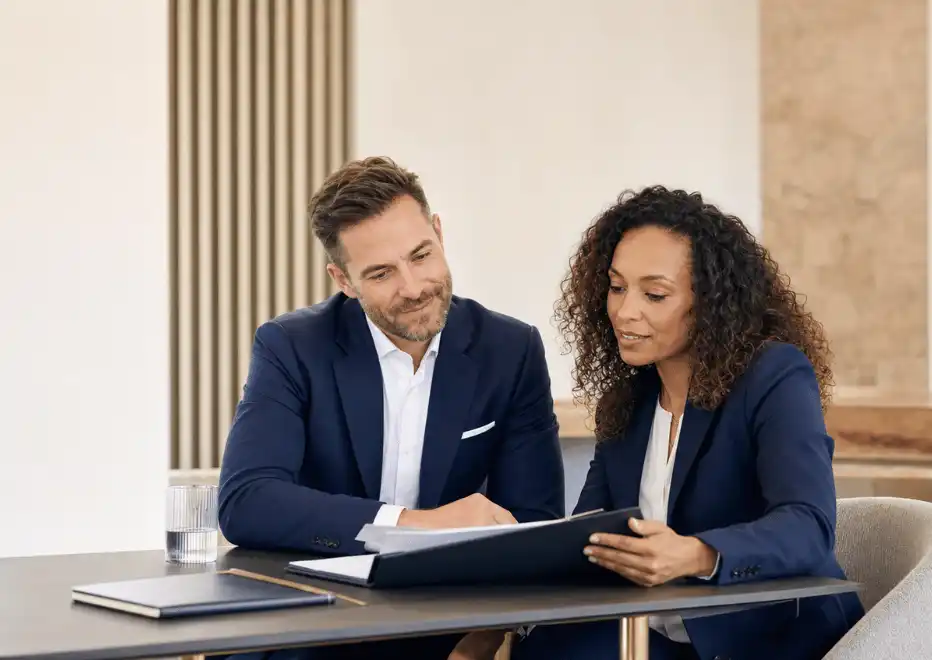 Professionals reviewing a development portfolio together