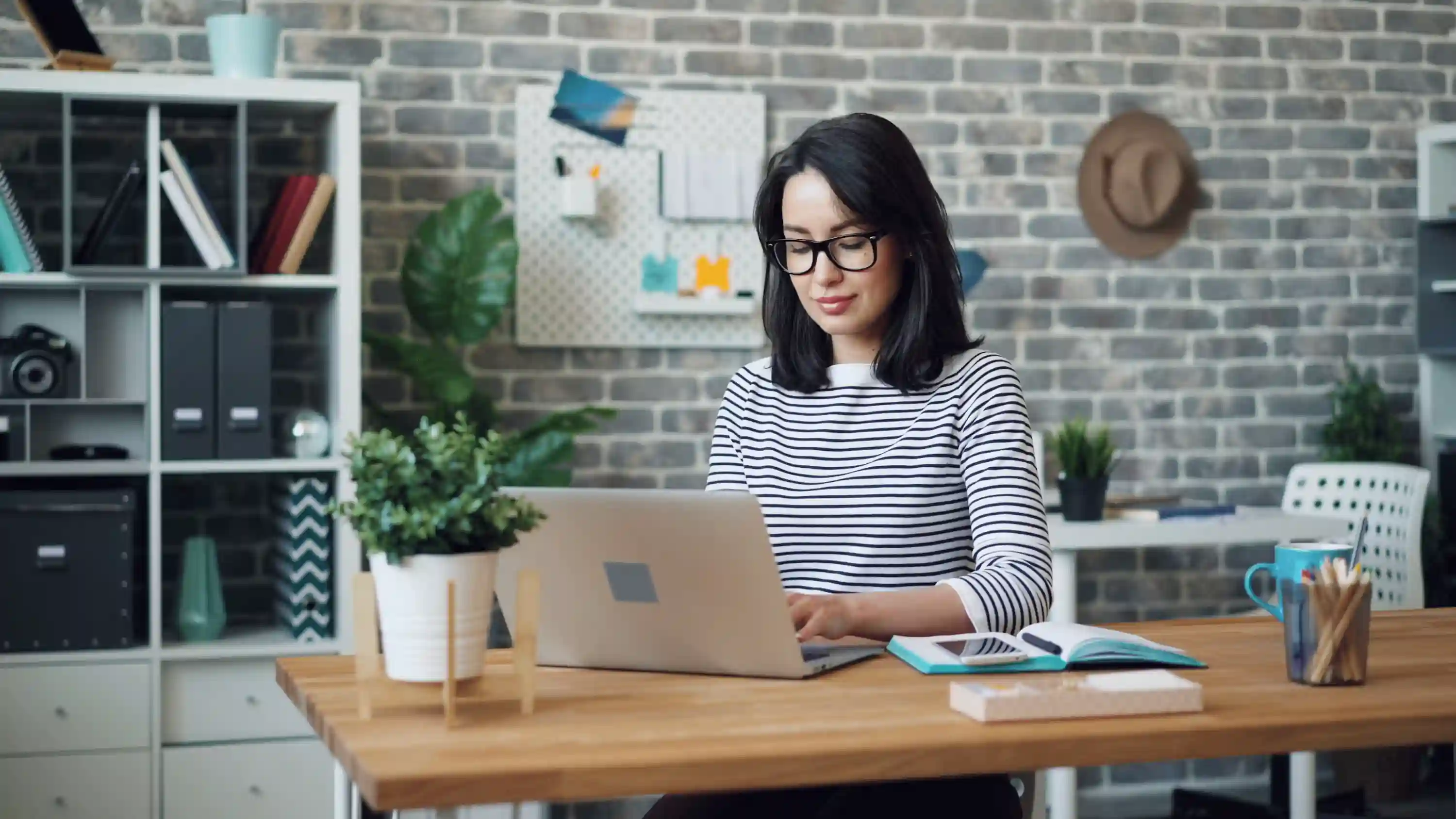 Learner working on a laptop in a calm professional environment