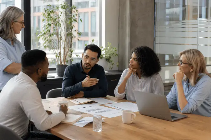 Employer team discussing workplace development